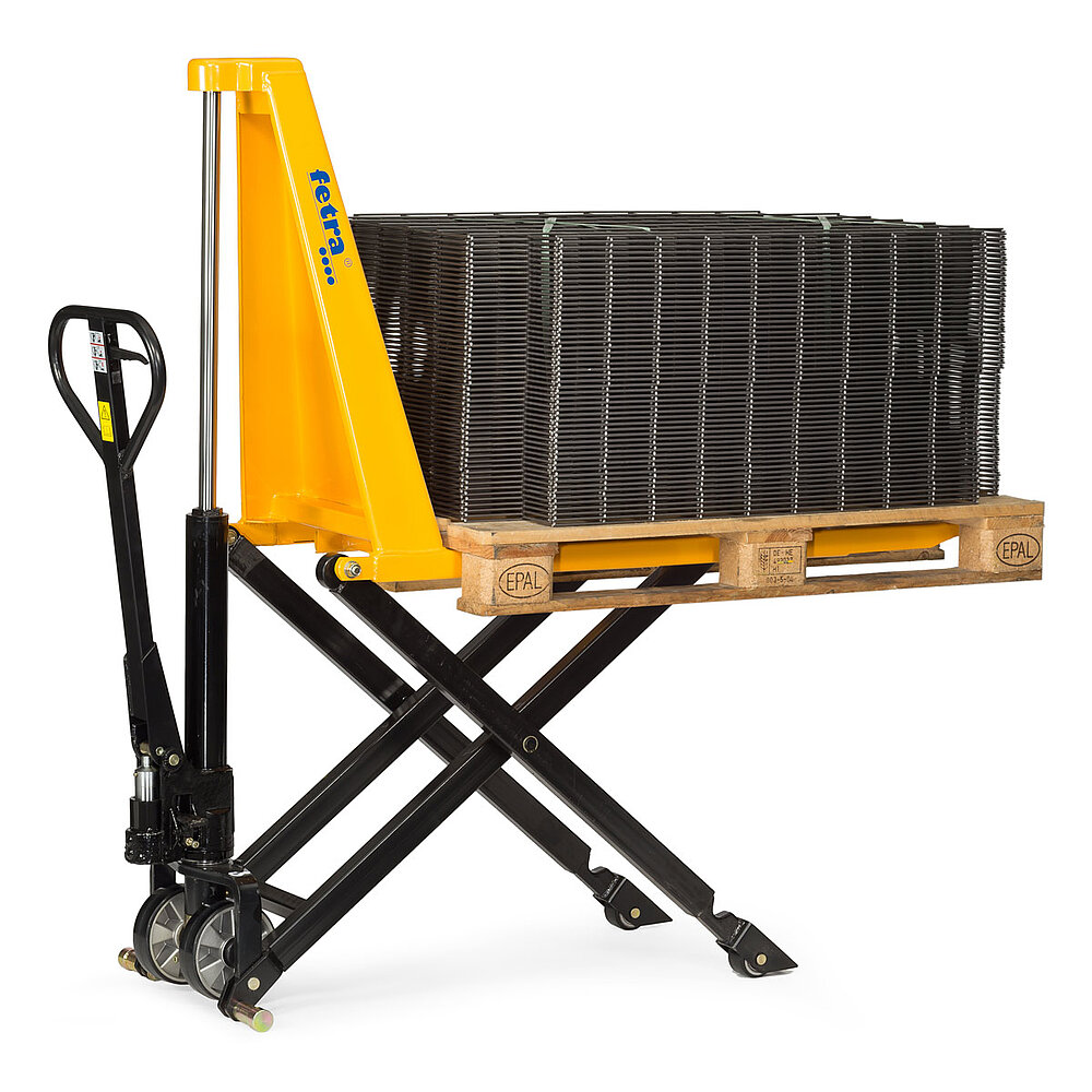 a yellow FETRA® high-lift pallet truck with elevated fork, loaded with a EURO palette with stacked steel mesh grills, and a black, rear-located steering drawbar with right-positioned operation lever, isolated on white background