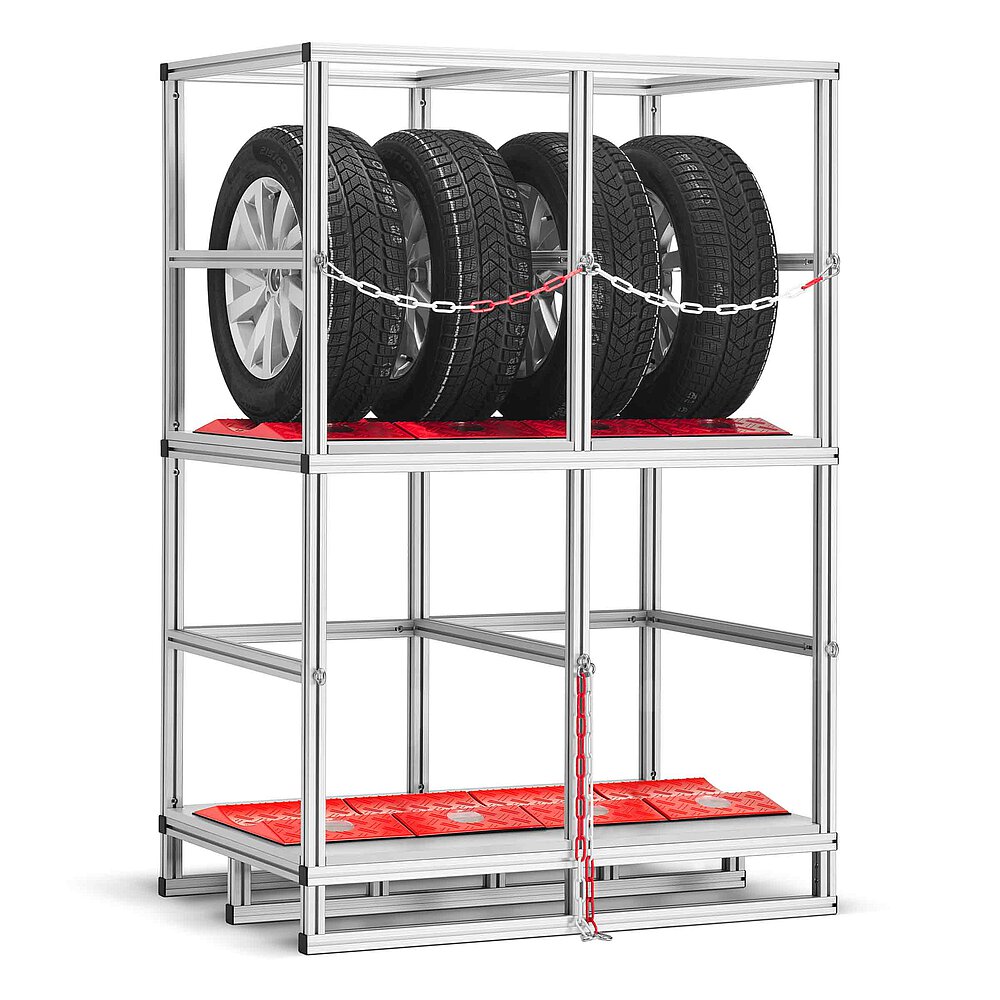 a tyre rack made of aluminium profiles with two storeys, each lined with red TyreGuard® tyre protectors, the upper storey loaded with four tyres on alloy rims and secured with a cross-wise chain, isolated on white background
