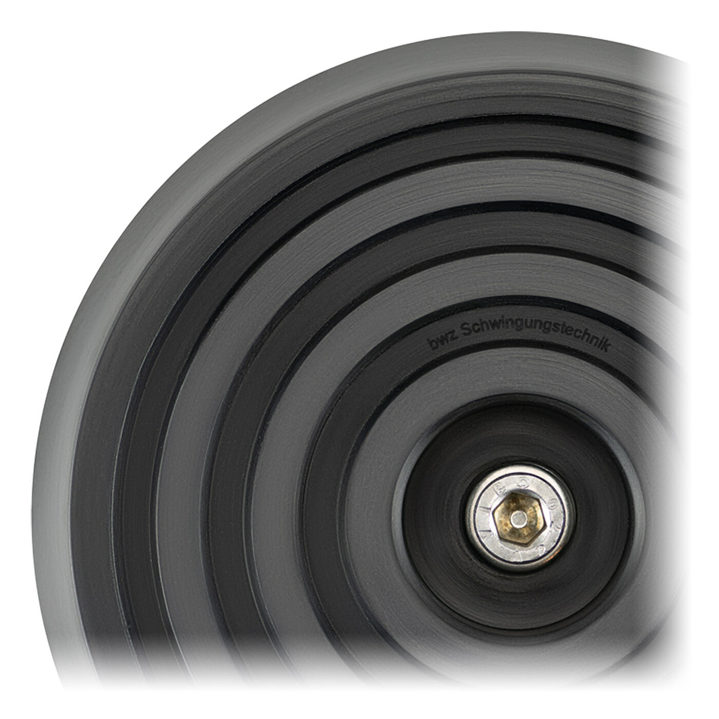 bottom side flat-lay view of the black elastomer of a bwz Schwingungstechnik® levelling element with four concentric profile rings for non-slip protection