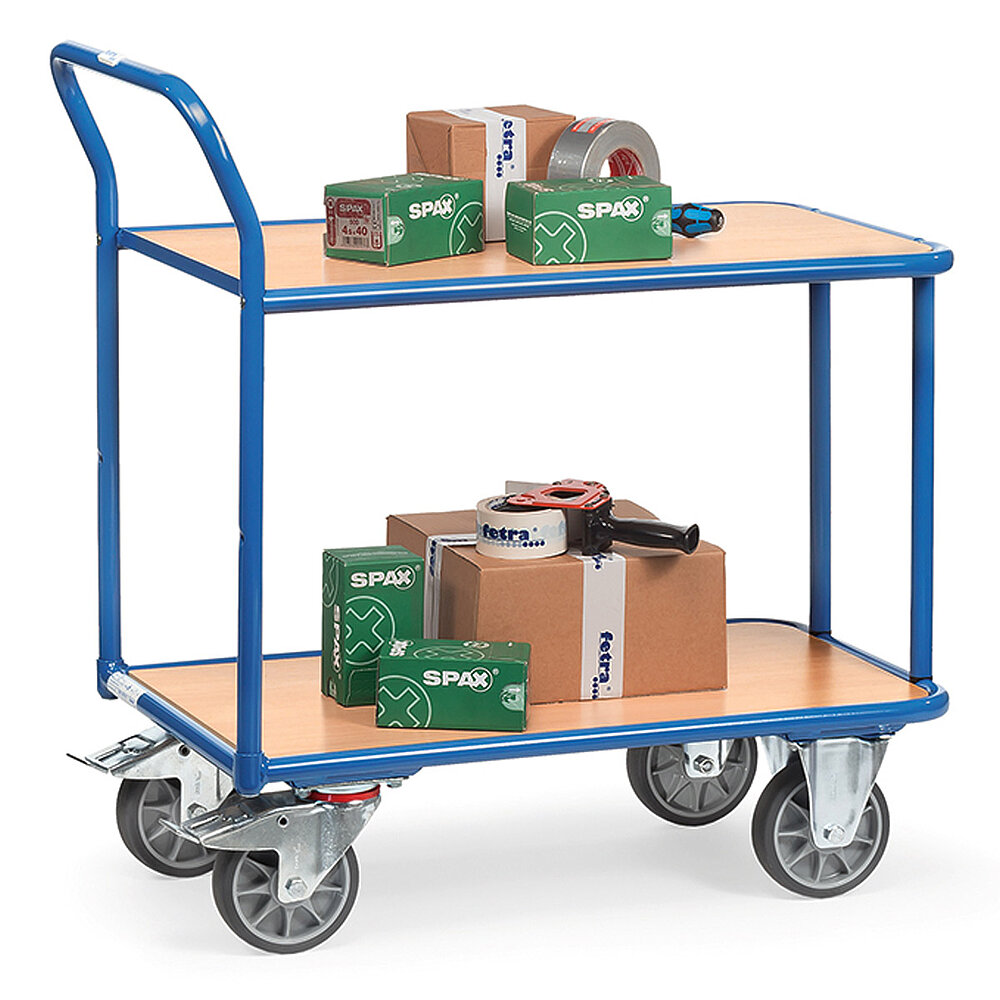 a blue FETRA® table-top storeroom trolley made of steel tubes, with two flush-fitting platforms of light-coloured wood, back-bent push bar, two fixed wheels at the front, two steering wheels at the rear, and loaded with cardboard boxes and packing tape roller, isolated on white background