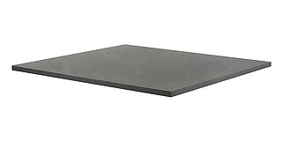 a black, square board of medium thickness and smooth surface, made of nitrile butadiene rubber NBR, for vibration damping underneath machines, isolated on white background