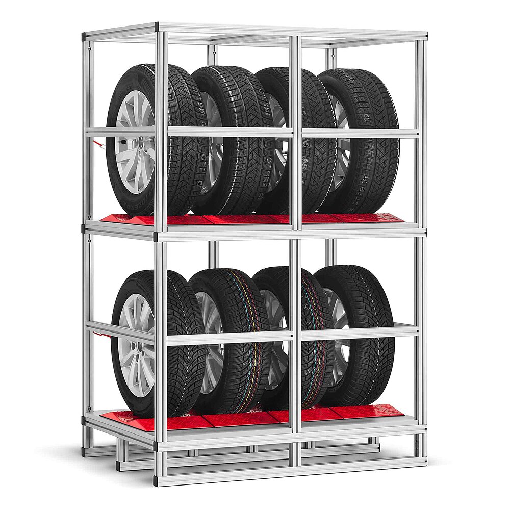 rear view of a tyre rack made of aluminium profiles with two storeys, each lined with red TyreGuard® tyre protectors and loaded with four tyres on alloy rims, both storeys enclosed with cross-bars made of aluminium profiles, isolated on white background
