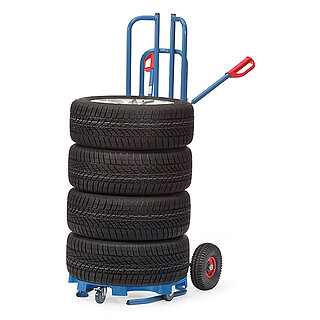 a blue FETRA® tyre truck made of steel tube with air tyres and red handles, on top of which a tyre dolley with four car tyres, isolated on white background