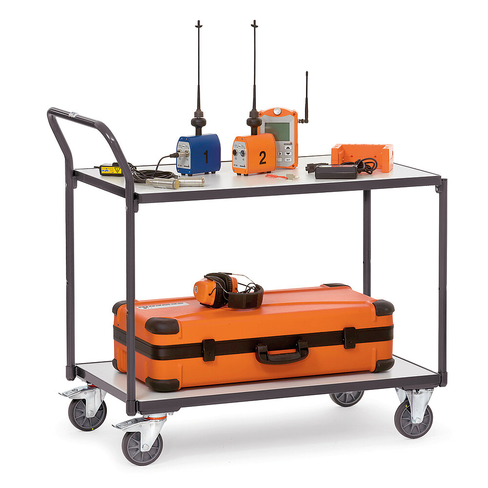 a shale-grey FETRA® table top cart in ESD version, with two storeys and loaded with various electronic measuring devices, isolated on white background
