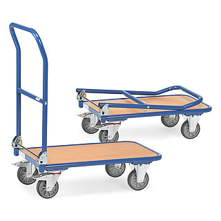 a blue FETRA® collapsible cart made of steel tube with low, rectangular platform of light-coloured wood, collapsible push bar, two fixed wheels at the front, two steering wheels at the rear, and a second, collapsed cart behind, isolated on white background