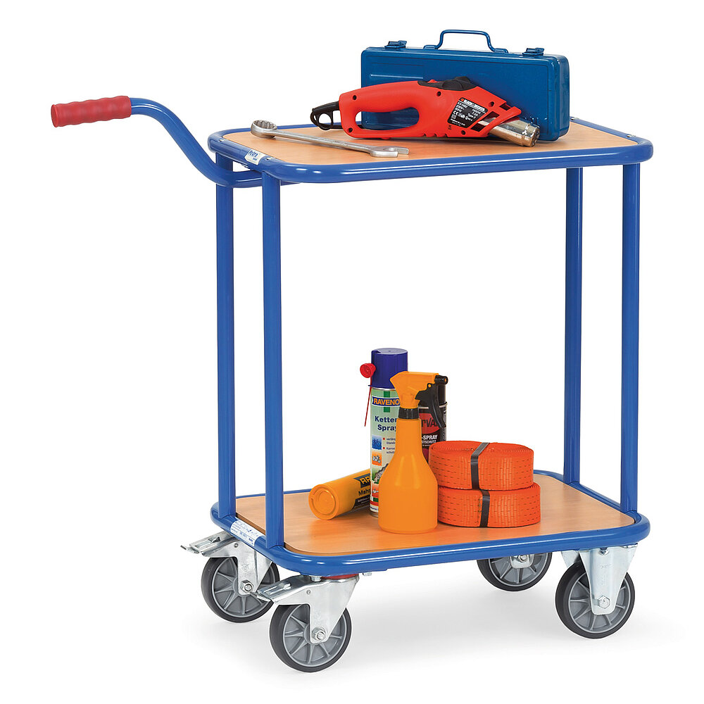 a blue FETRA® dolly with gooseneck handle made of steel tube, with two light-brown loading platforms, two fixed wheels at the front, two fastenable steering wheels at the rear, a short push bar with red handle, and loaded with a hot air gun and orange-coloured lashing straps, isolated on white background