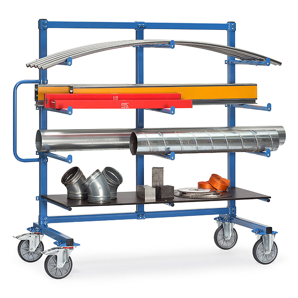 a blue FETRA® trolley with carrier spars, featuring four storeys, removeable brown wooden inlay boards and loaded with diverse plumbing tubes and fittings, isolated on white background