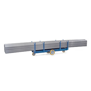 a blue elongated FETRA® trolley for long goods, with eight vertical tubes and four rhombically positioned wheels with polyurethane tyres, and loaded with a long grey bundle of tubes, isolated on white background