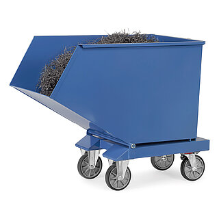 a blue FETRA® tipping container made of steel, filled with metal saw dust, equipped with forklift pockets and four grey wheels, isolated on white background